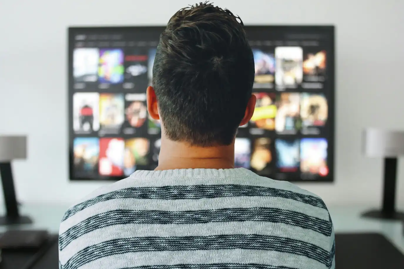 tv man watching room office