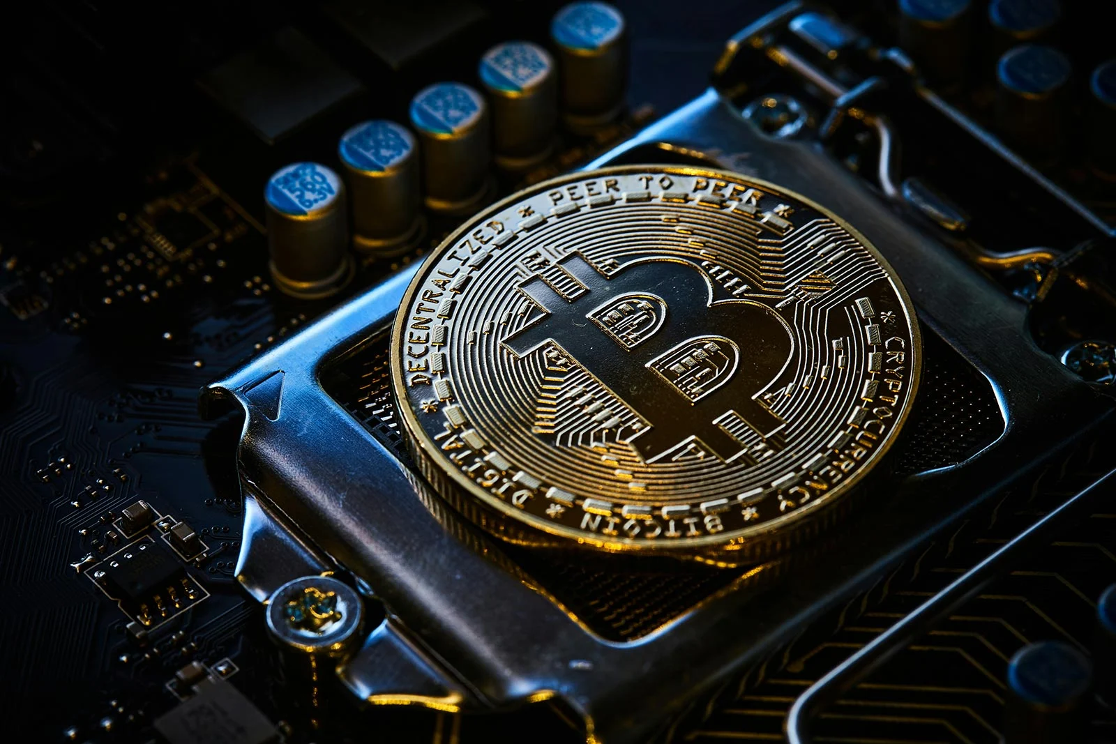 bitcoin coin on computer motherboard