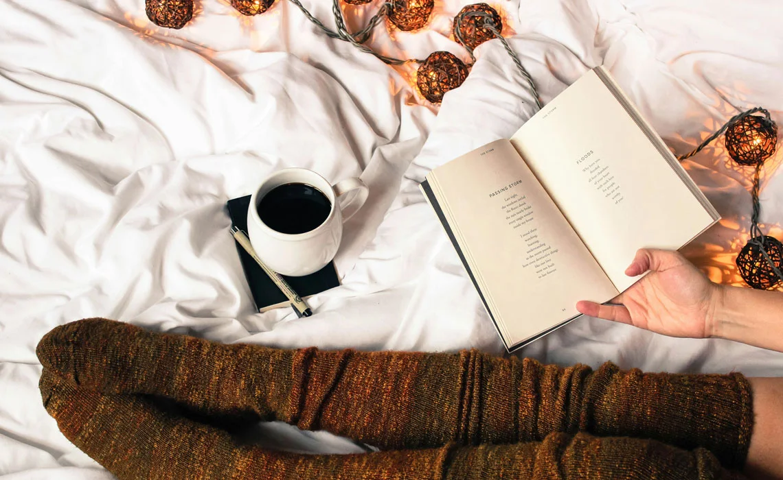 Coffee beside open book