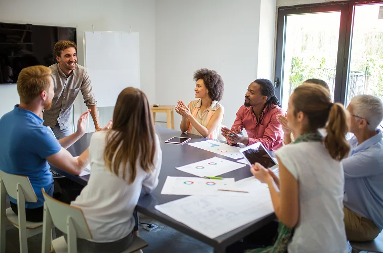 group of business partners discussing documents