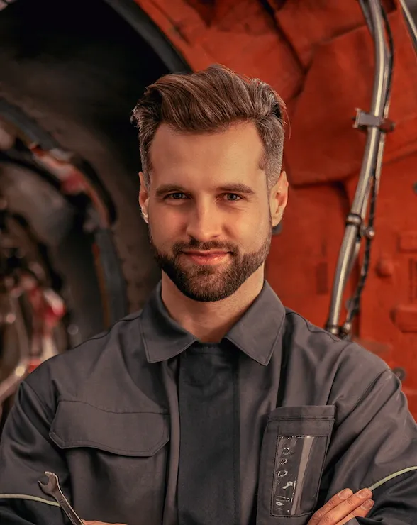 male aircraft mechanic standing