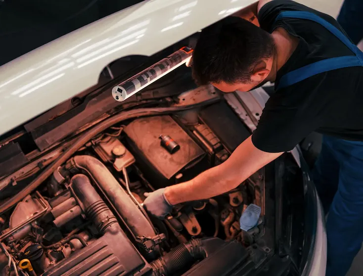 man in work uniform repairs