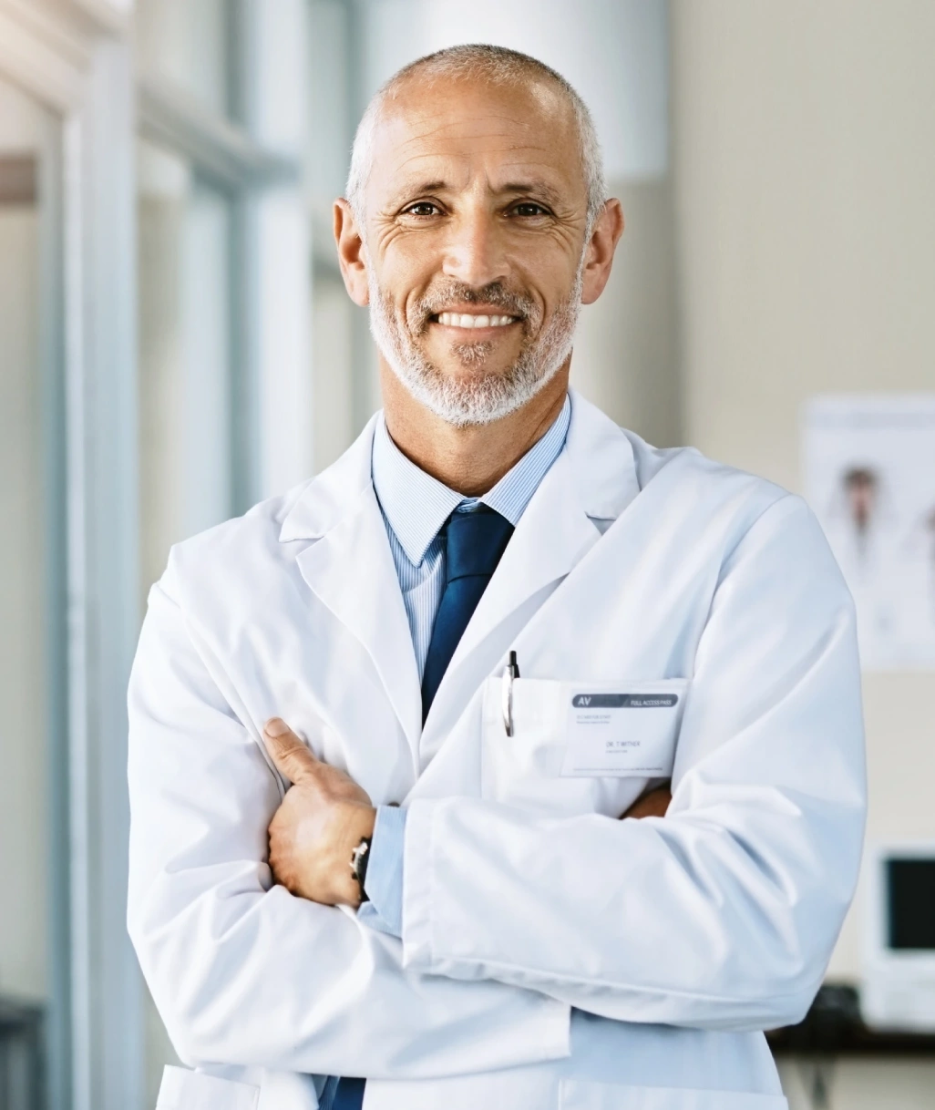 senior male doctor on white lab smiling