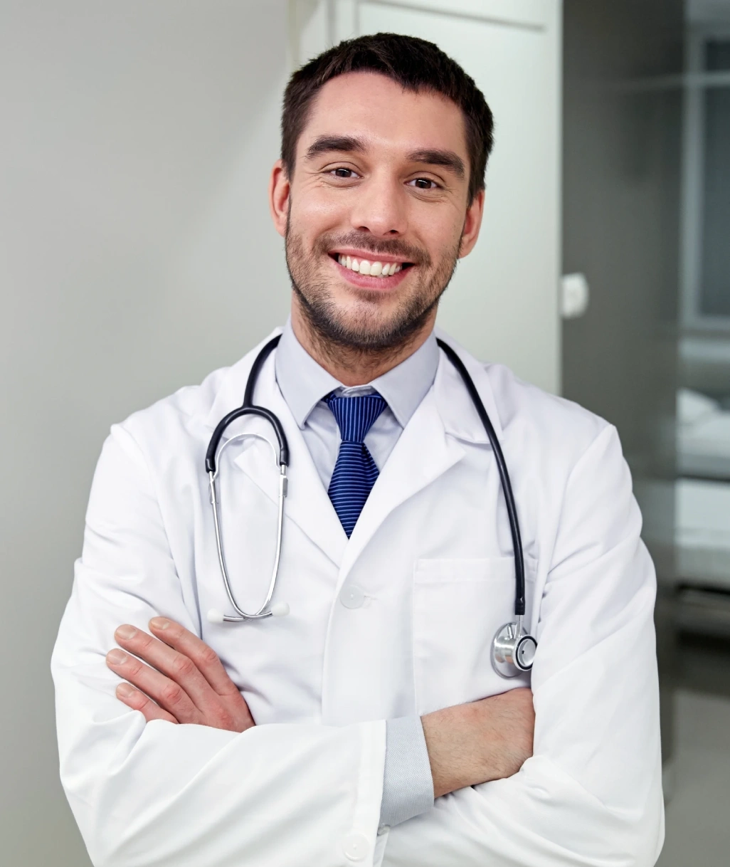 male doctor posing with big smile