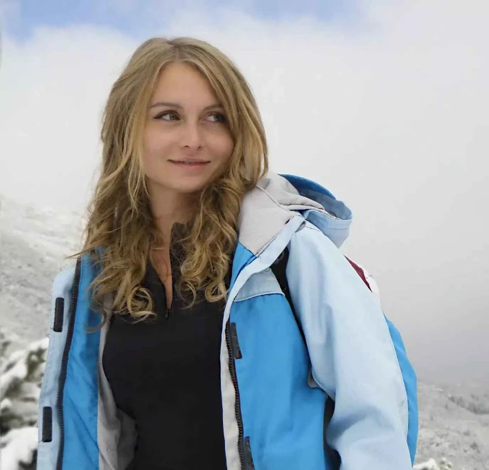 woman mountain snow cold